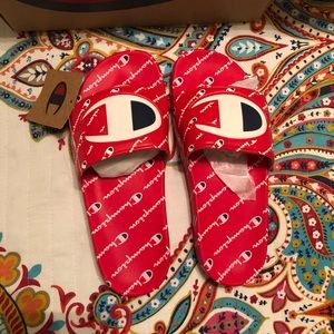 UNISEX RED LOGO ALL OVER CHAMPION SLIDES